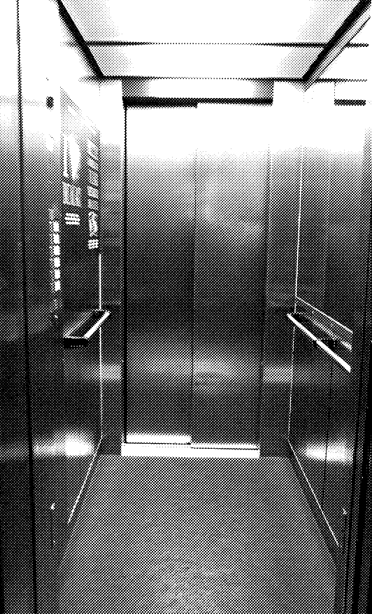 A black and white picture of the inside of an elevator